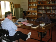Pastor Chris Mwilu and David Gravino in Bible College library.JPG
